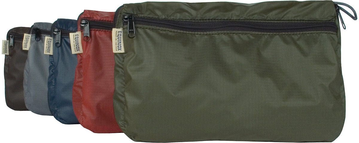 Equinox Monarch travel organizers shown closed in assorted colors