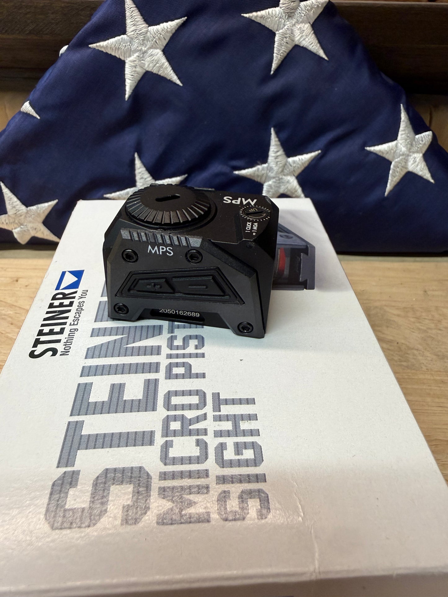 Steiner MPS sight showing side brightness buttons and top battery cover