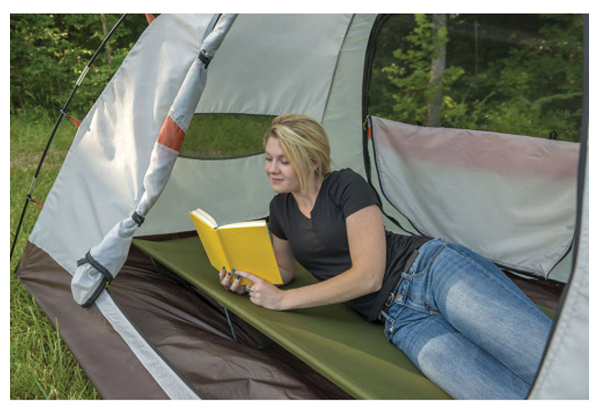 Camper reading inside an ALPS Taurus tent