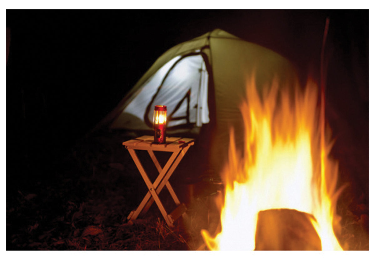 ALPS SideKick supporting a lantern outside a tent near a campfire