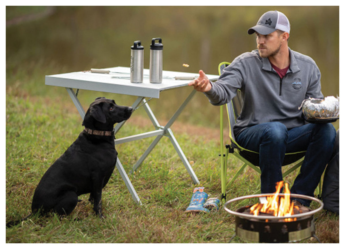 ALPS Square Dining Table in Silver beside a camper, dog and fire pit
