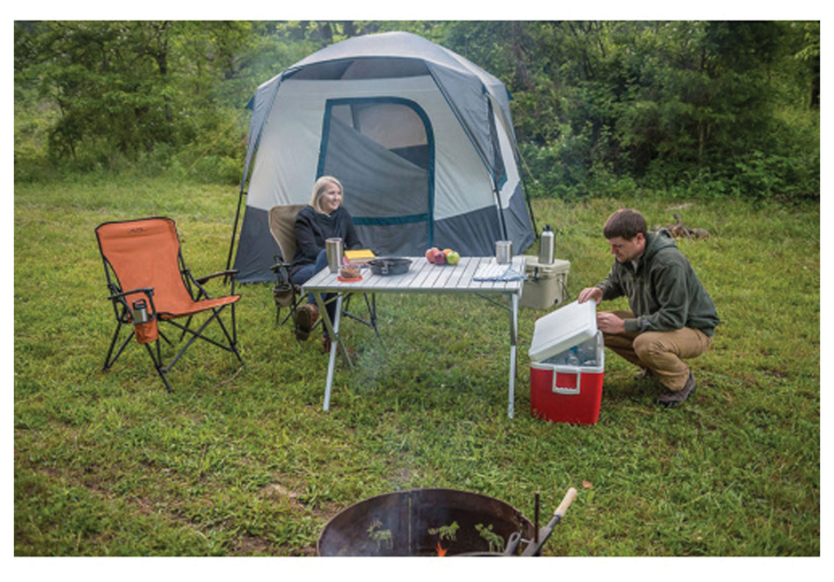 ALPS aluminum dining table at a campsite with folding chairs, tent and cooler