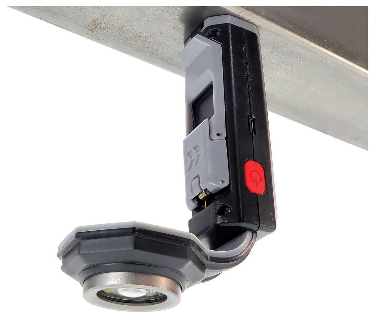 STKR FLEXIT Pocket Light 4.0 attached upside down beneath a metal surface with its magnetic base