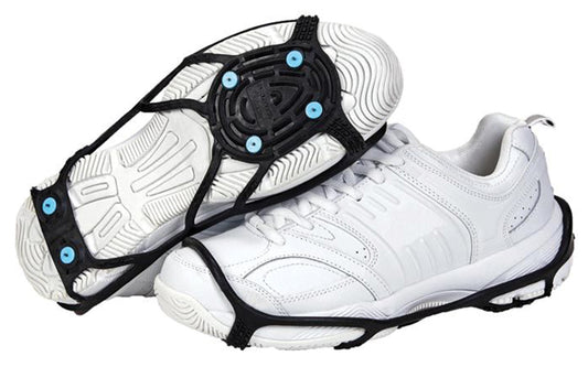 White shoes fitted with Due North traction aids and blue spikes; this listing is for six replacement spikes only