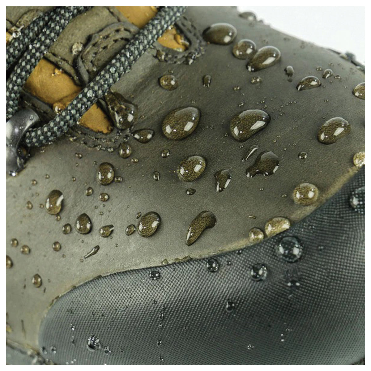 Water droplets beading on a boot in the Grangers Waterproofing Wax gallery