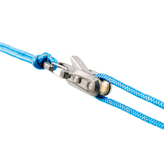 Close-up of a Rollercam Roperoller tensioner threaded with blue accessory cord