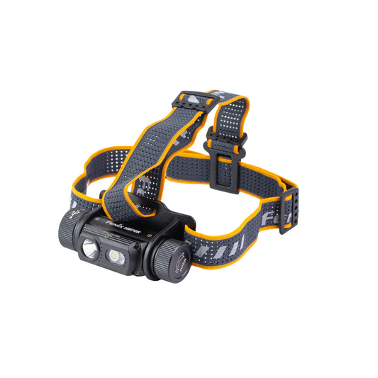 Fenix HM70R headlamp with black and yellow headband and overhead strap, angled front view