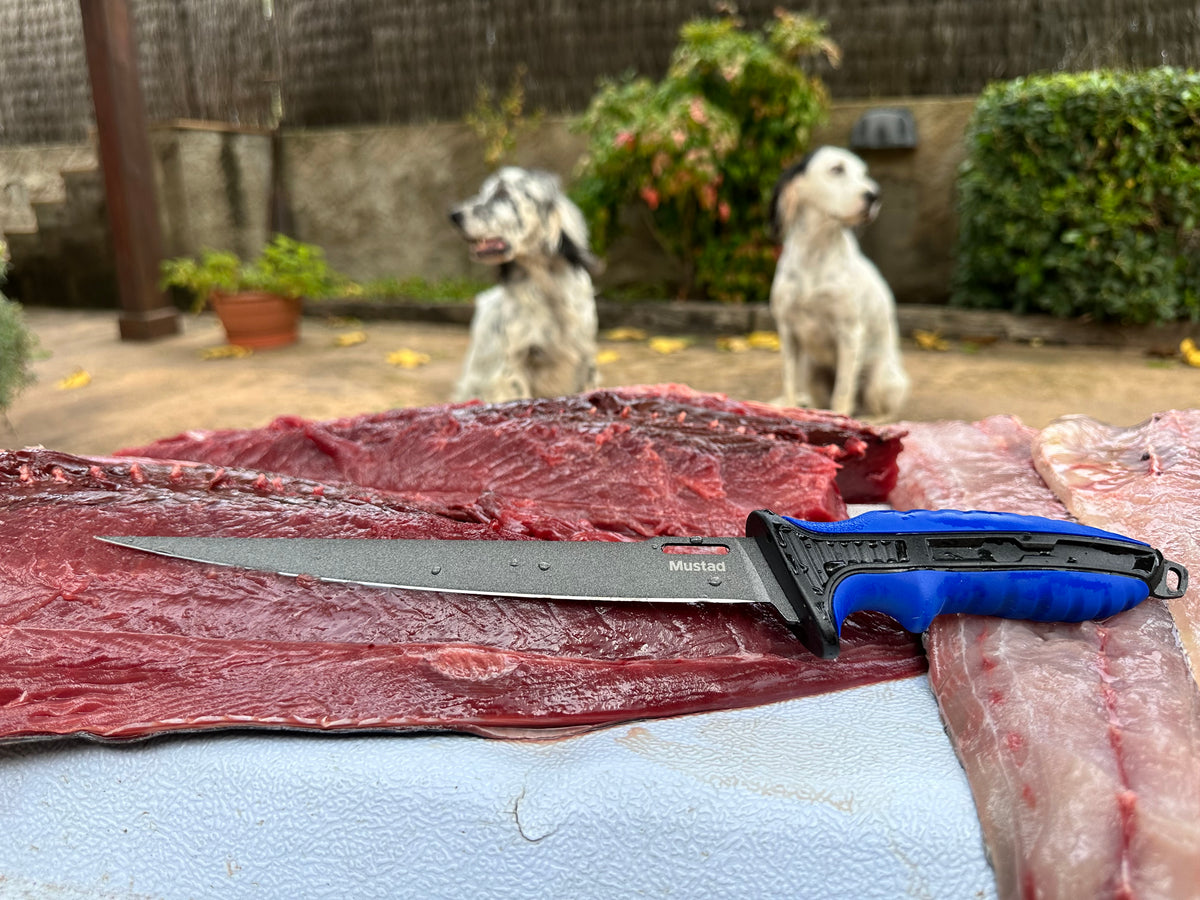 Mustad fillet knife shown while preparing fish