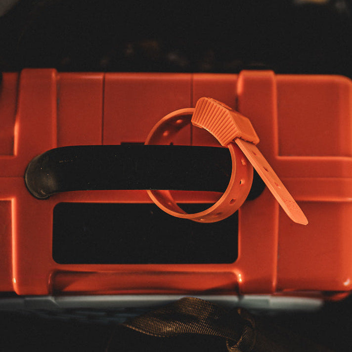 Orange Hoss strap on a storage-container handle
