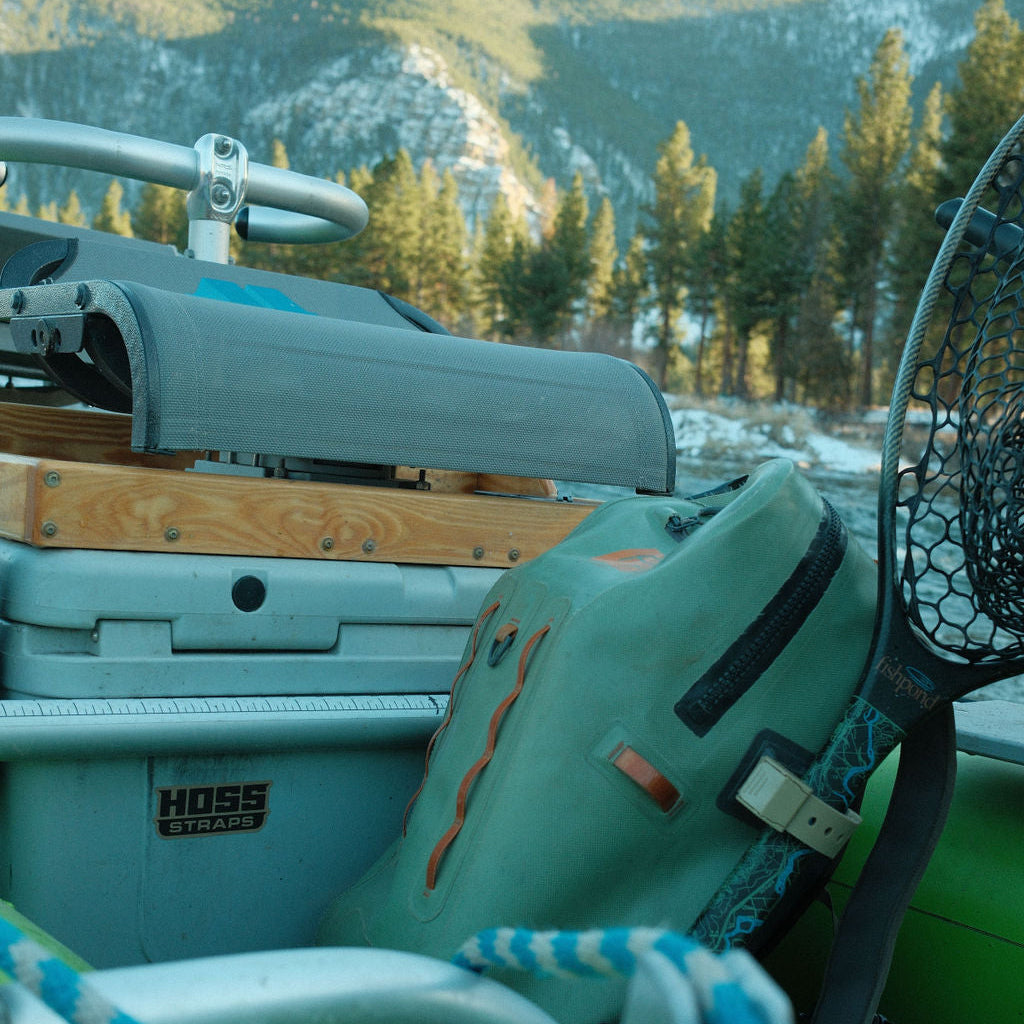 Hoss gear strap shown with a cooler at camp