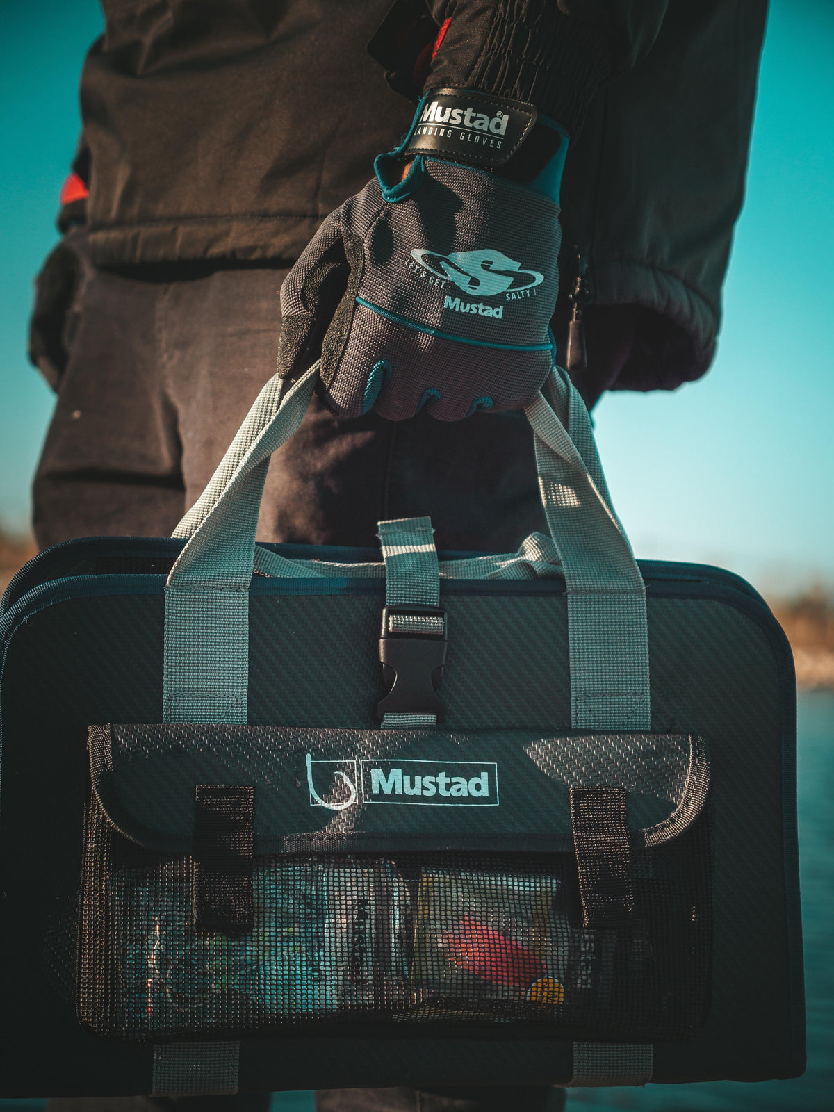 Angler carrying a Mustad jig bag