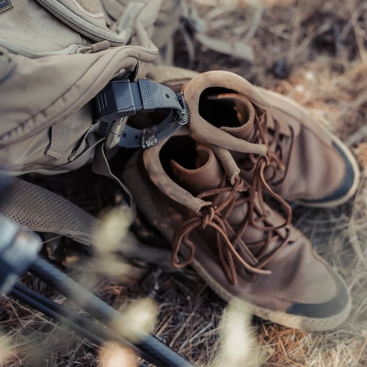 Hoss gear strap holding footwear on a backpack