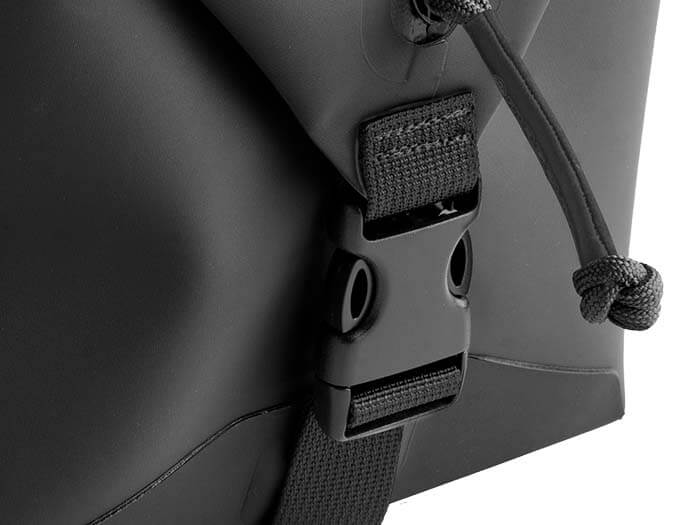 Close-up of a fastened side buckle on a black Magpul DAKA Takeout Large bag