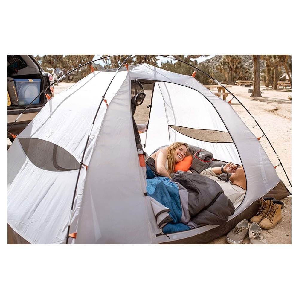 Orange ALPS Versa pillow in a campsite sleeping setup