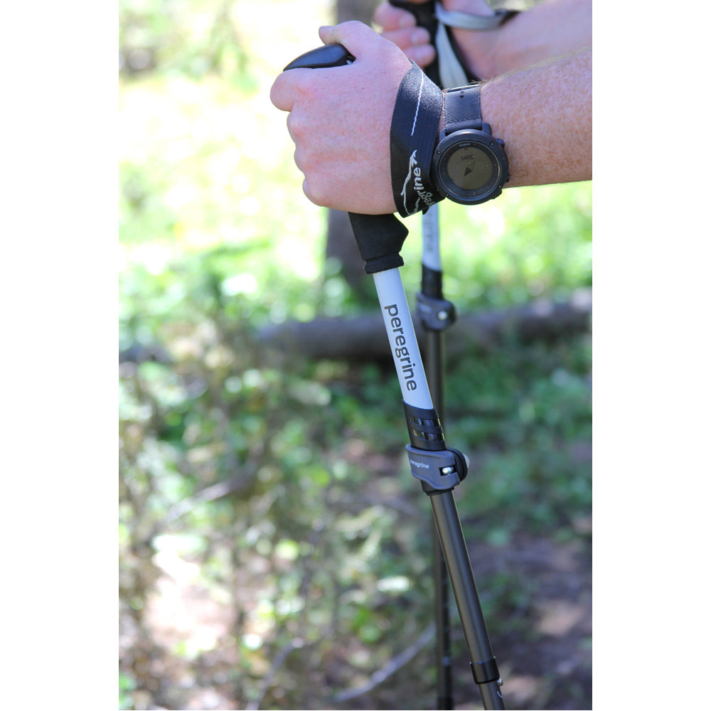 Close-up of a hiker holding Peregrine trekking pole grips and straps