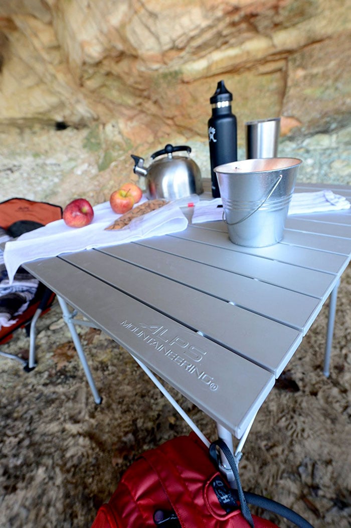 Close-up of ALPS Camp Table set with a kettle, cup and bottle