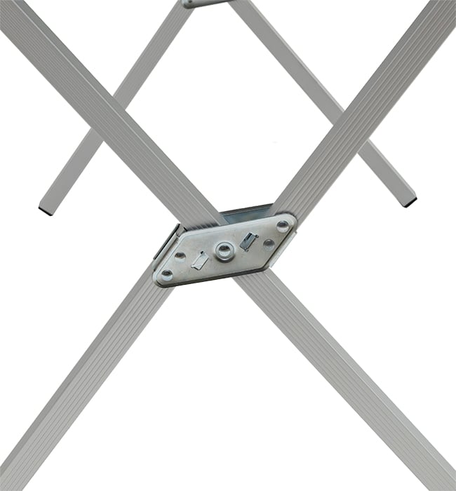 Close-up of the crossed aluminum legs and center hinge on an ALPS dining table