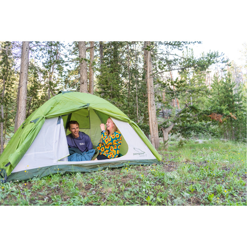 Campers using Peregrine Link-Up field quilts inside a tent