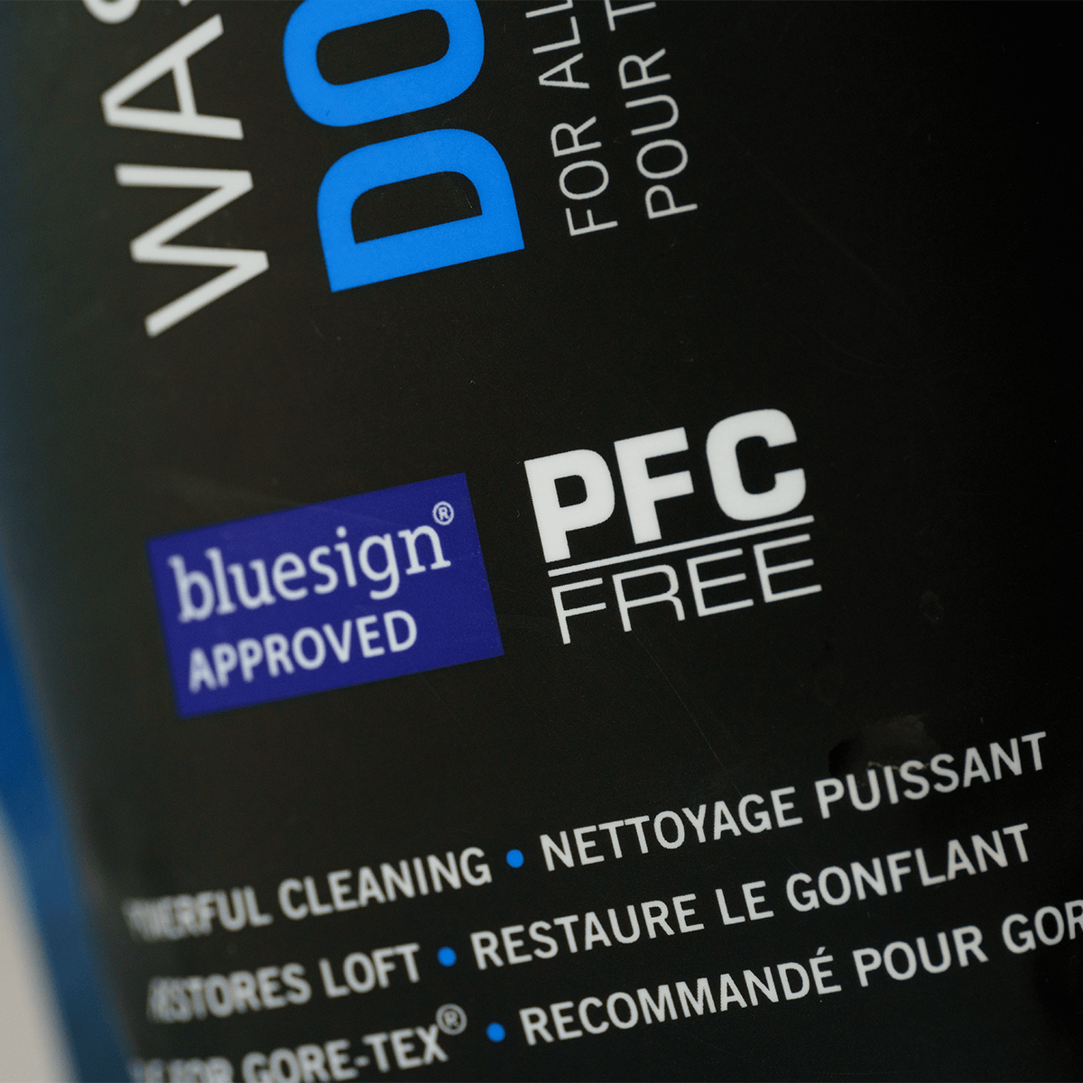 Close-up of the bluesign approved and PFC-free labels on the Grangers Wash + Repel Down pouch