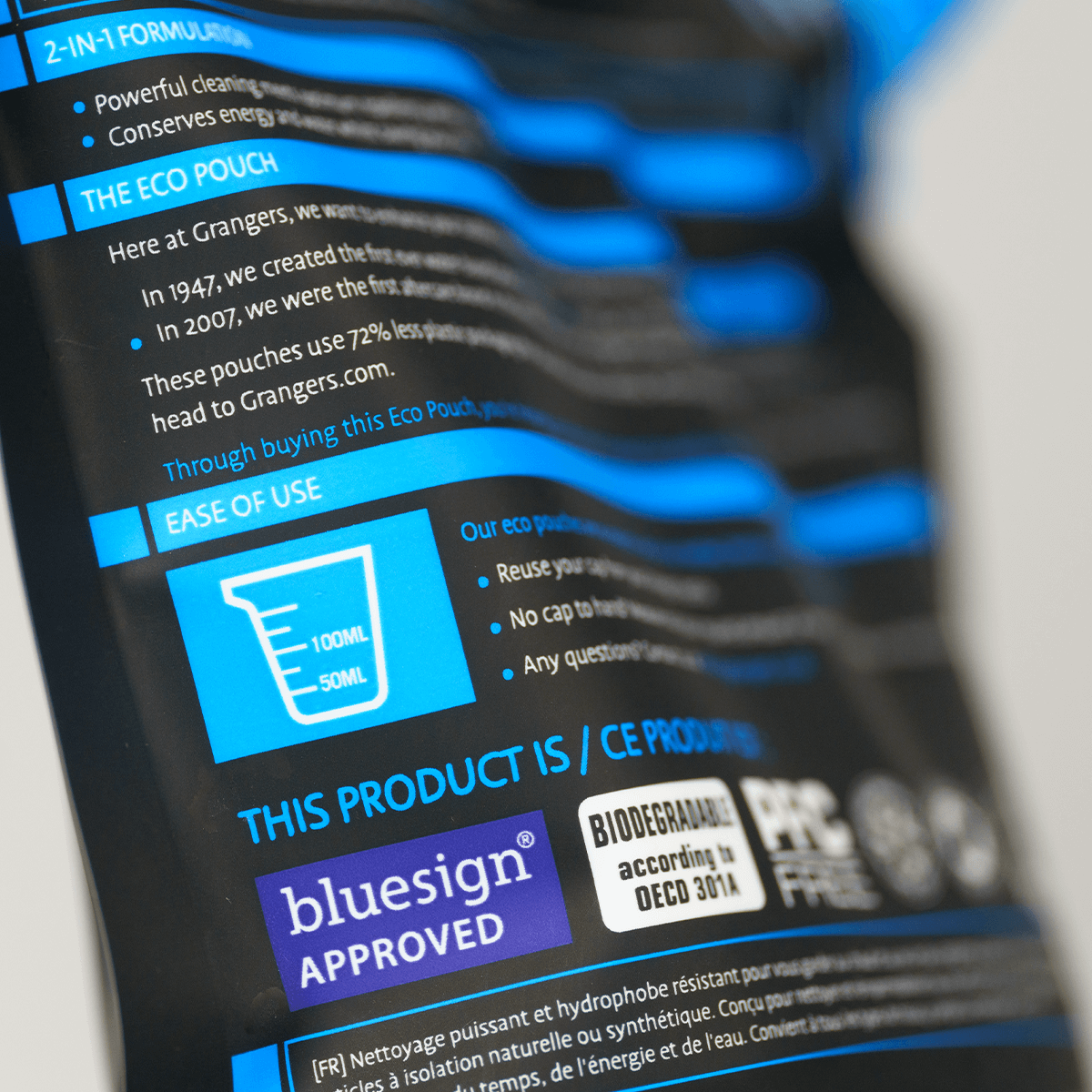 Close-up of the measuring-vessel graphic and instructions on the Grangers Wash + Repel Down pouch