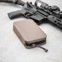 Flat Dark Earth Magpul DAKA Utility Organizer, Standard, on a work surface beside equipment
