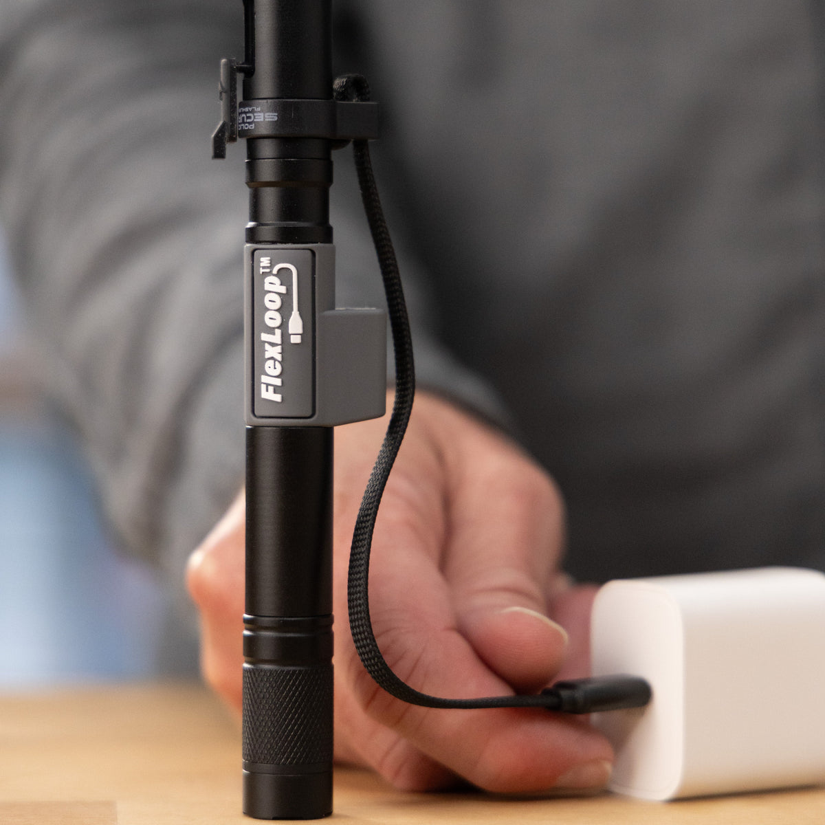 Police Security FlexLoop R — attached charging cord in use
