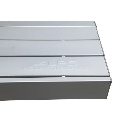Close-up of silver tabletop slats and ALPS Mountaineering logo