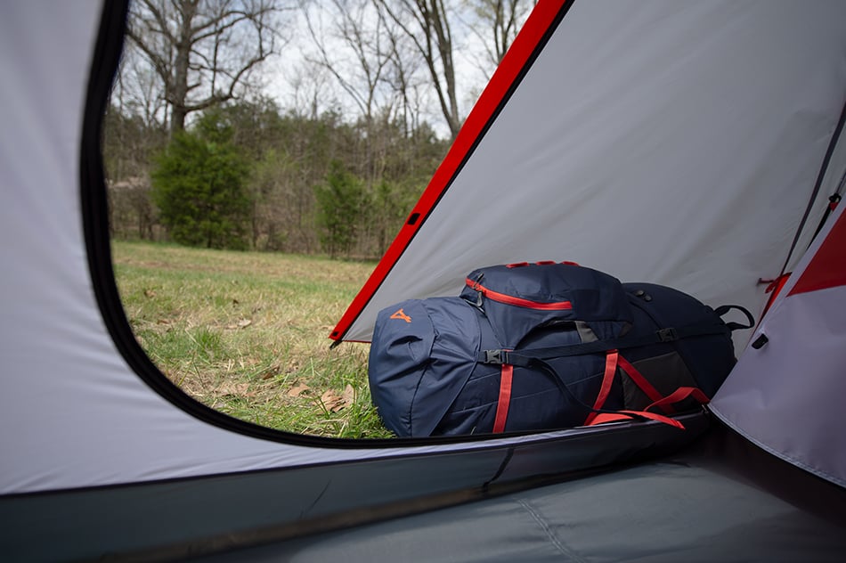 Backpack stored in the vestibule of an ALPS Taurus tent
