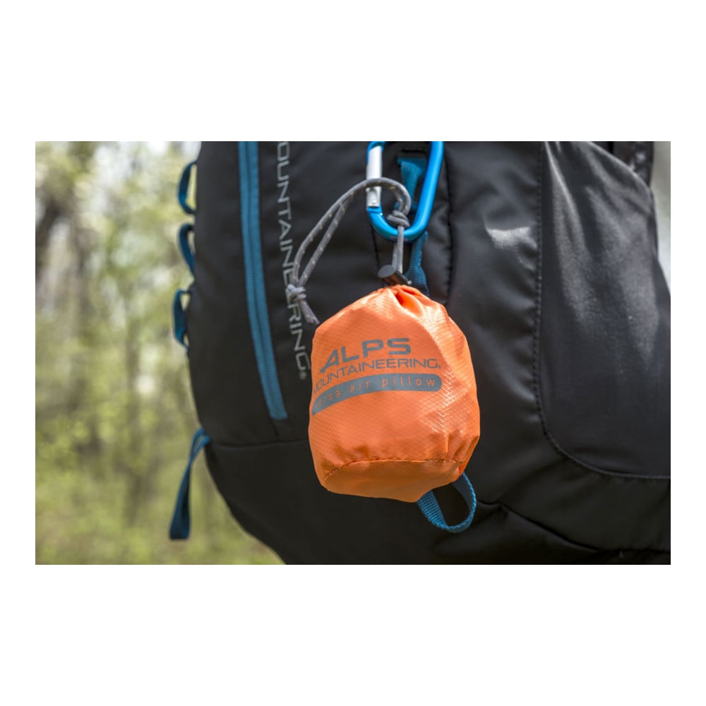 Orange ALPS Versa pillow stuff sack clipped to a backpack