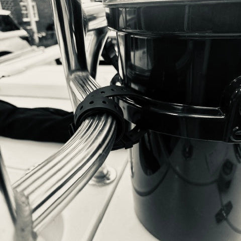Hoss strap securing gear to a bucket